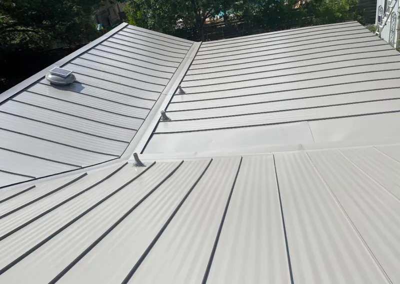 Solar attic fan installed on a metal roof for Roof Ventilation in Easttown
